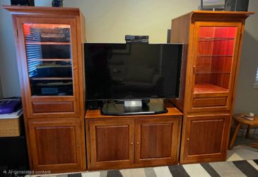 Thomasville sold wood TV center and bookshelves