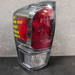 2016-2017-2018-2019-2020-2021-2022-2023 TOYOTA TACOMA LEFT TAIL LIGHT OEM USED #9558