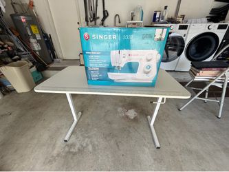 Foldable sewing table/singer sewing machine