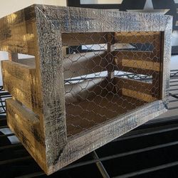 rustic wooden crate with chicken wire,