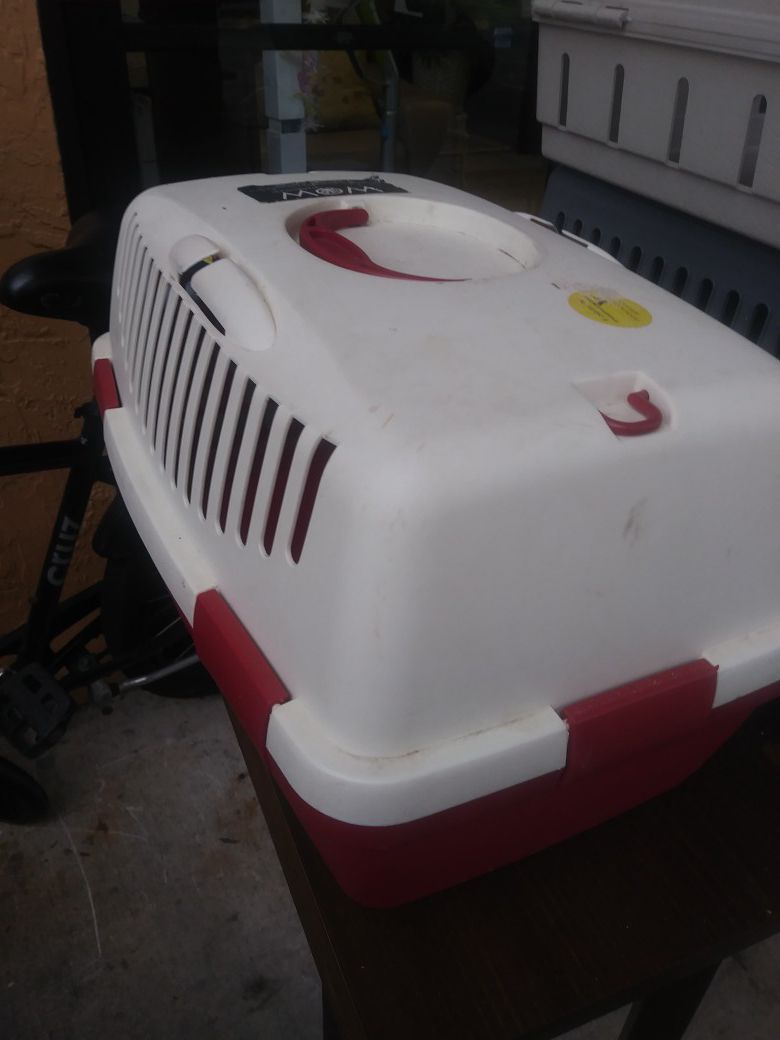 Small red and white pet carrier