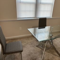 4-person Glass Table With Matching Gray Chairs