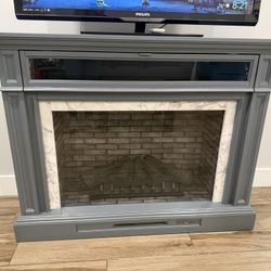 52" Modern Fireplace TV Stand - Faux Marble  $125 Description: Selling a beautiful Home Decorators Collection Keighley electric fireplace TV stand. I’