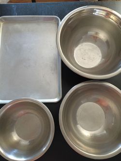 3 Mixing bowls stainless and 1 sheet pan.