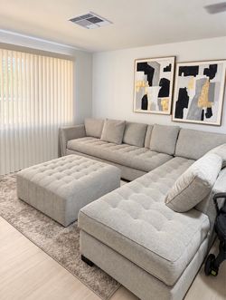 Light Gray Tufted Sectional Sofa with Matching Ottoman