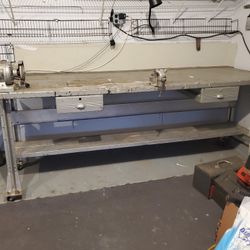 THIS IS A VERY UNIQUE SHOP WORKBENCH SOLID METAL ON CASTER VERY LARGE