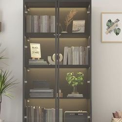 63-inch high showcase with glass doors and lights black $140 