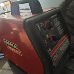 red Lincoln Electric Weld-Pak 100 MIG welder.