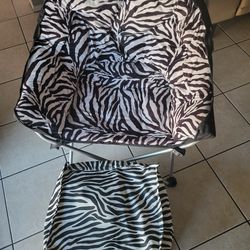 Folding chair with footrest.