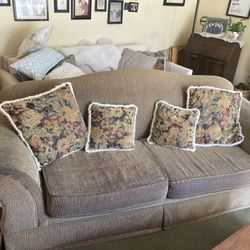 A Love Seat And A Couch 