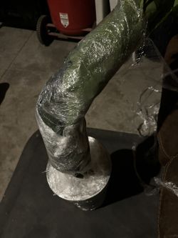 Fake plant with white rocks In Pot