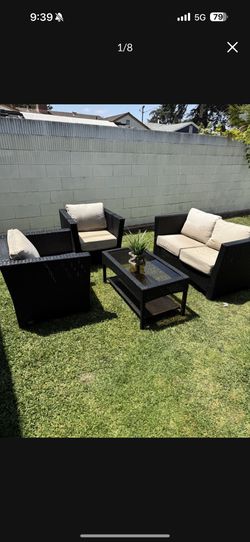 4 piece .modern Zen. Wicker outdoor furniture cushions bottom ripped. $200