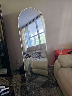 Mirror full length standing or hanging. Light gold trim Mirror 63.5" x 20.5"