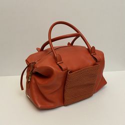 Salvatore Ferragamo leather handbag •woven front pocket •in mint condition  