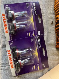 Two sets of Sylvania H11 headlight bulbs (4 total) new in package unopened