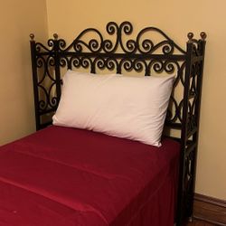 Two single beds with wrought iron headboards and mattresses included (very little use)