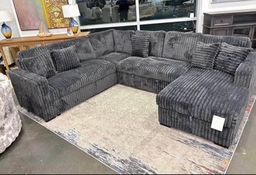 Black Corduroy Fabric Sectional with Pull-Out Bed and Storage Chaise. Brand New.