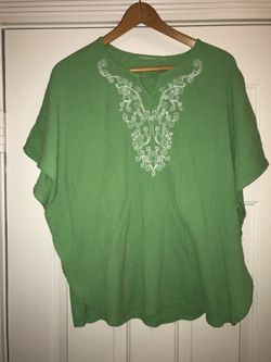 Green tunic top, with decorative embroidery around neckline. Women's, size medium