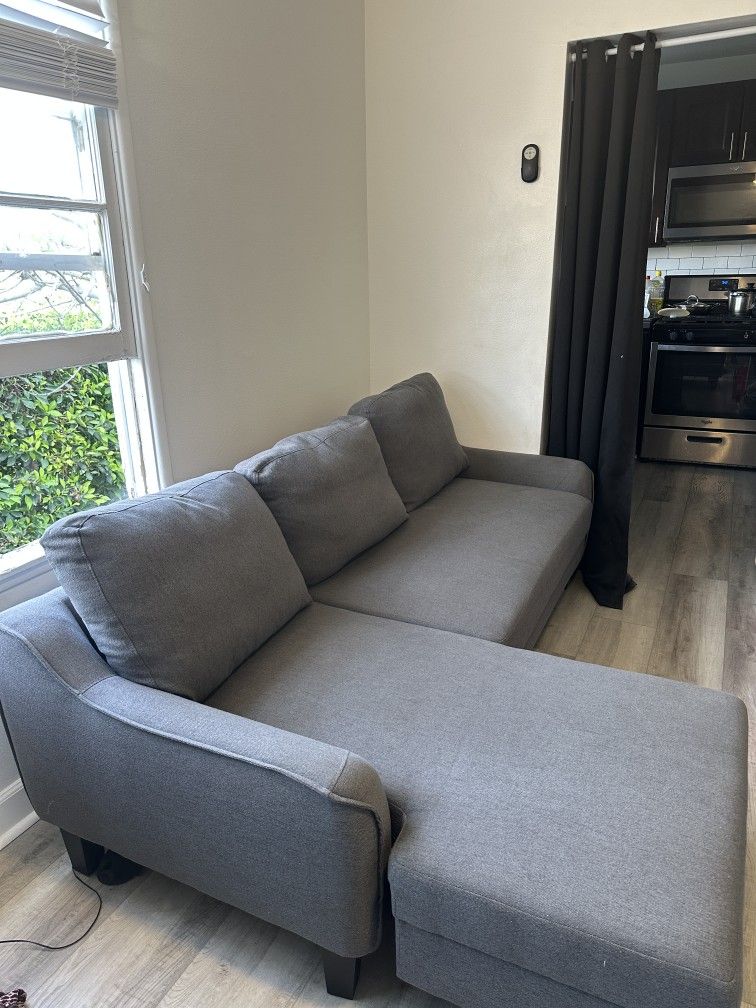 Signature Design by Ashley Jarreau Modern Sectional Sleeper Sofa Couch with Chaise Lounge, Blue