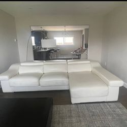 White leather sectional with adjustable headrest