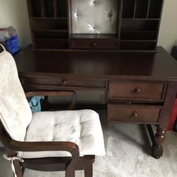 Brown wooden desk with hutch and chair