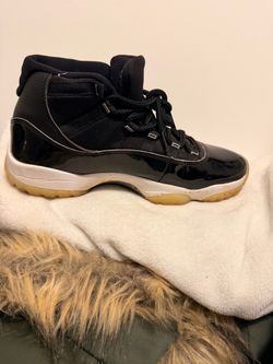 Air Jordan 11 Black Patent Leather Sneakers