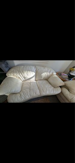 White leather couch and loveseat.