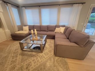Grey sectional couch with chaise lounge.