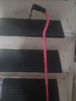 The Carex Ergo Offset Cane in a pink rose pattern