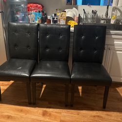 A Set Of Black Furniture Chairs 