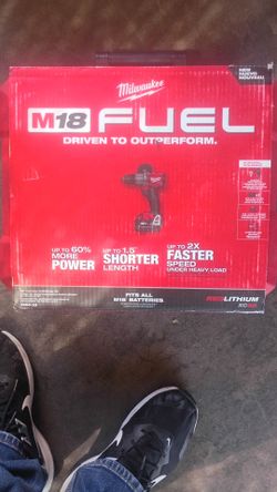 Milwaukee fuel hammer drill with 2 batteries 5.0ah and charger.+ Hard case