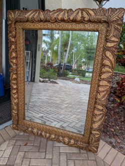 Antique wooden beveled mirror from Indonesia. Handcrafted.