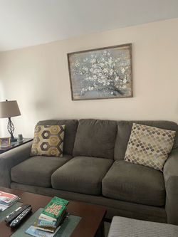 2 grey couches, love seat and standard sofa