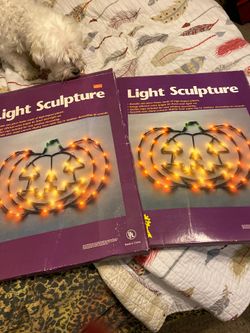 2 pumpkin light sculptures