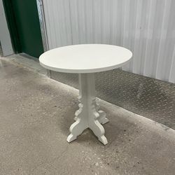 Elegant white side table. 20” high ,19” round .. $35