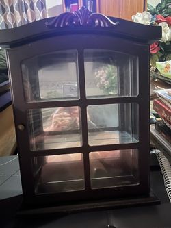 Very small curio cabinet