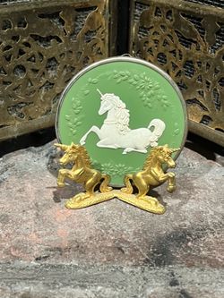 Vintage gold metallic unicorn stand with 1980 unicorn ornament