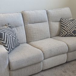 Modern Light Grey Reclining Couch With Two Pillows