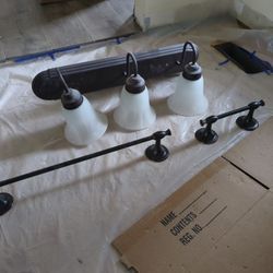 Bathroom vanity light, towel and toilet paper hanger