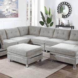 New 8 Piece Modular Sectional .  Grey Chenille Fabric .  102”x132”x66”.  Free Delivery !