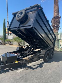 Scissor lift dump trailer