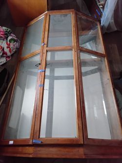 Beautiful mirror back glass hutch