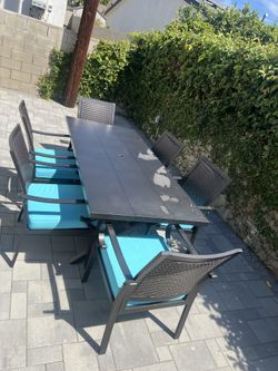 Outdoor big  iron table with 6 beautiful chairs.