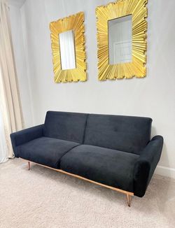 Black sofa bed with rose gold legs