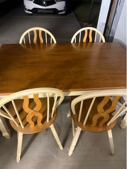 Dining table with four chairs.