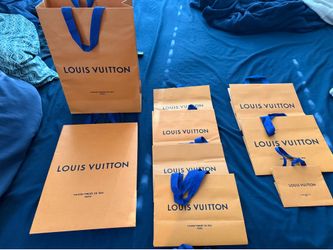 Authentic Louis Vuitton shopping bags, multiple sizes.