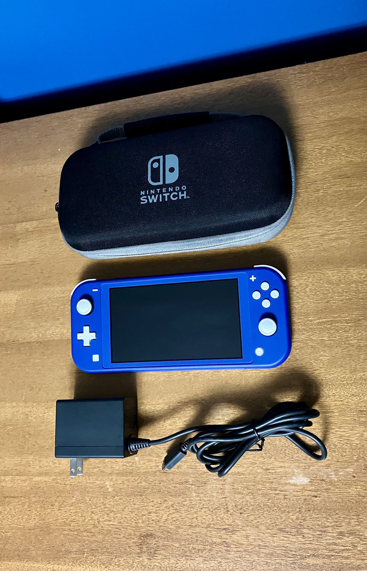 Nintendo Switch Lite video game system with Original Charger + Travel Carrying Case Blue color Like New
