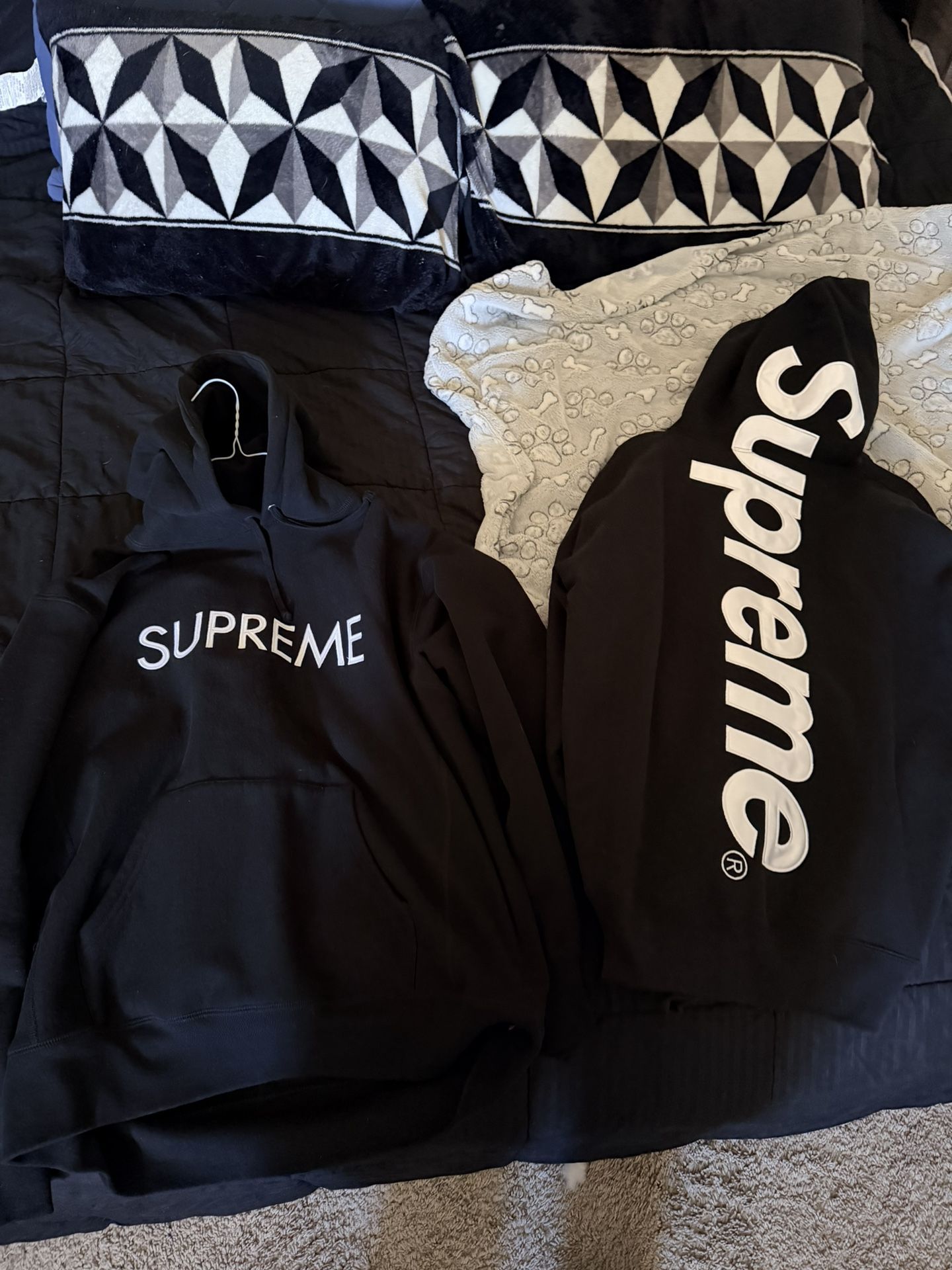 Two Supreme Sweaters