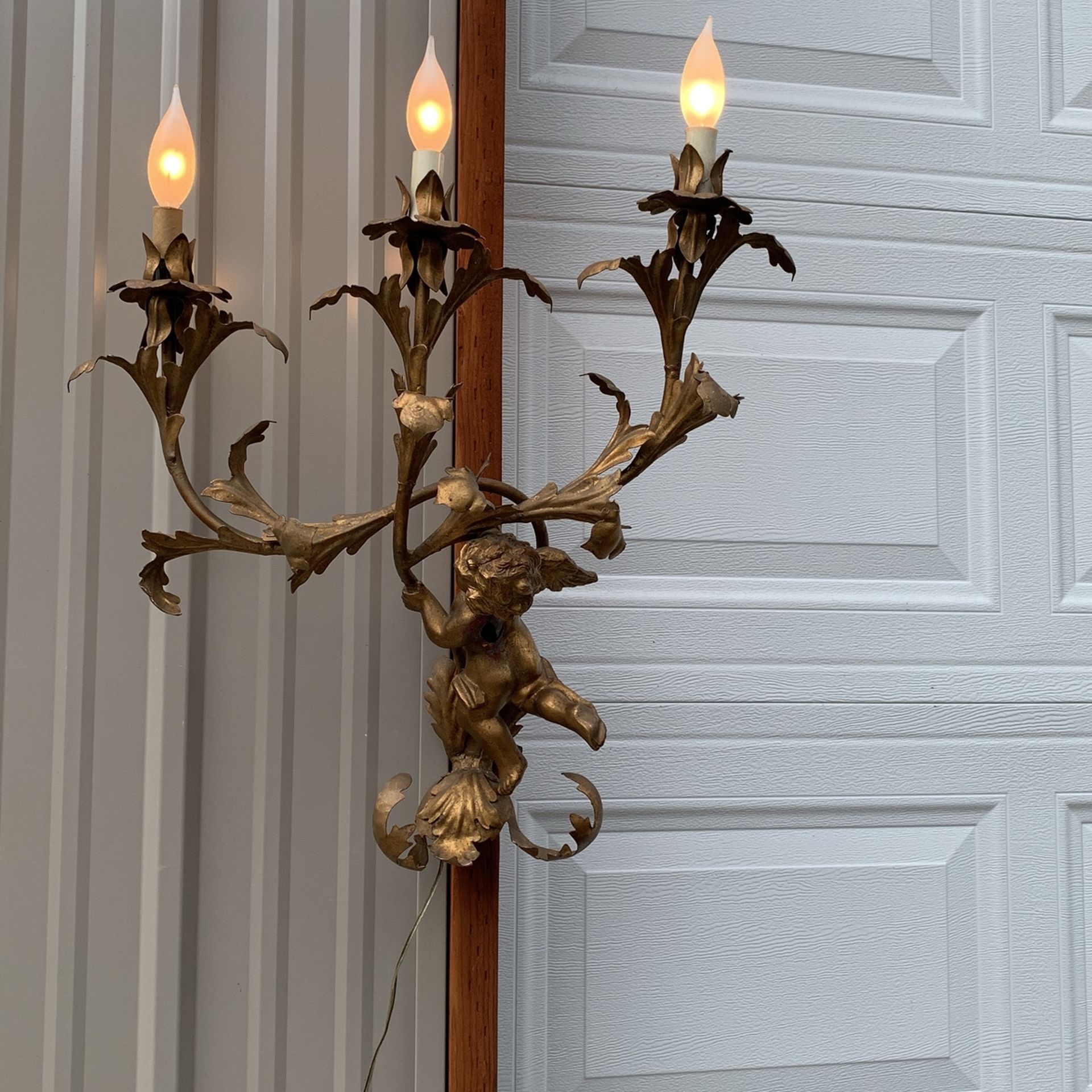 Cherub Regency style Italian three light wall sconces