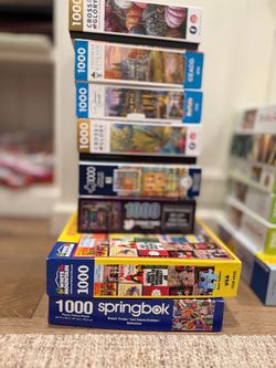 Lot of 8 1000-Piece Jigsaw Puzzles